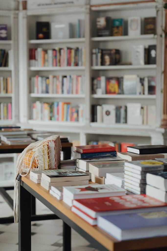 Books and string bag on tables in a library with shelves in the background. Perfect for educational themes.